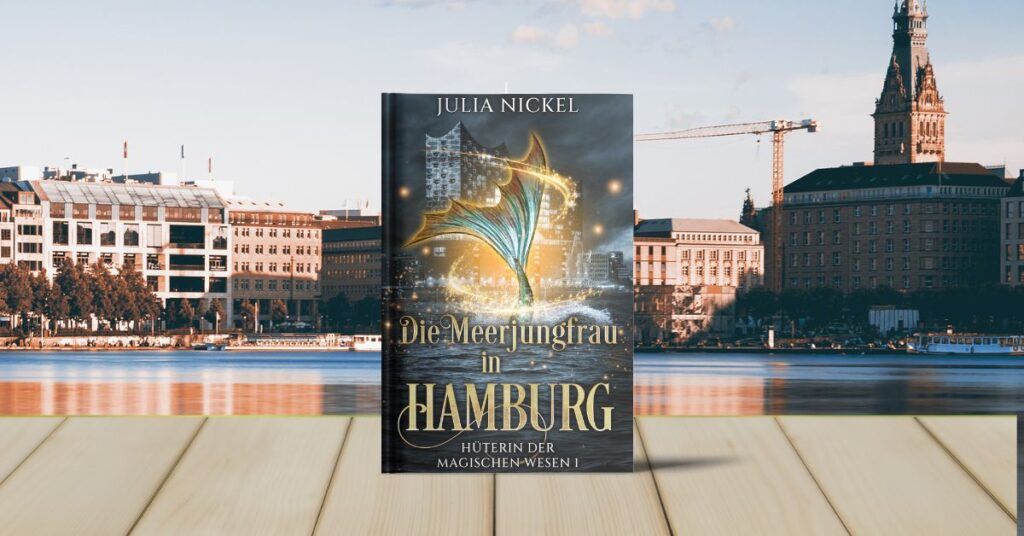 Mein Buch Die Meerjungfrau in Hamburg vor der Aussicht auf die Hamburger Binnenalster
